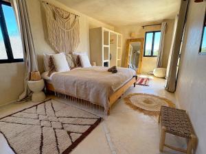 a bedroom with a large bed in a room at Palais Zoa in Essaouira