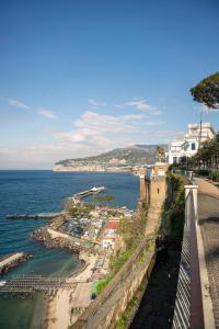 a view of the ocean and a city at Palazzo Tasso in Sorrento