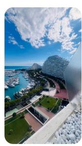a view of a city with a building and a harbor at Casa Monica Nizza VILLENEUVE-LOUBET in La Celle-sous-Gouzon