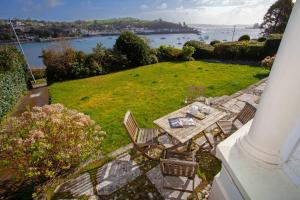 an aerial view of a patio with a table and chairs at Riversdale in Falmouth