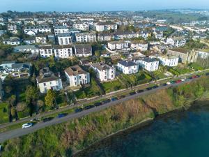 an aerial view of a city with houses and a highway at Riversdale in Falmouth