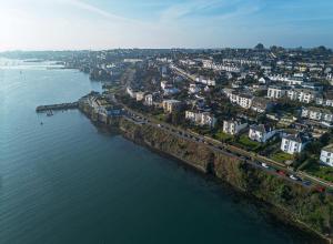 an aerial view of a city next to the water at Riversdale in Falmouth