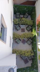 an overhead view of a garden on the side of a building at Hotel Amadora Palace in Amadora