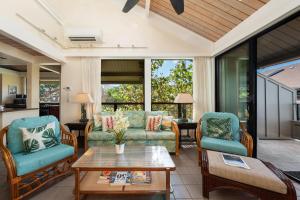 a living room with two chairs and a table at Kahana Village 2 · KHV 2 Direct Oceanfront 2BD Condo Steps to Be in Kahana