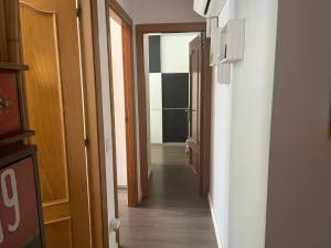 a hallway with an open door to a room at Apartment - Ampolla in L'Ampolla