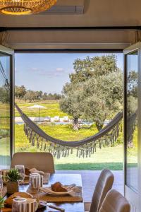 a dining room with a view of a large window at Monte do Sossego by Portugal Active in Ferreira do Alentejo +52 photos
