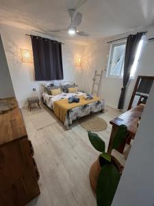a bedroom with a large bed in a room at Alpinia villa O'Mangos in Saint-François +41 photos