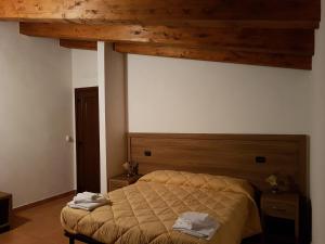 Postel nebo postele na pokoji v ubytování Agriturismo L'Ulivo
