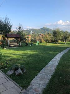 a park with a gazebo in the grass at Casa Cu Lavandă in Valea Drăganului