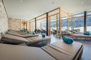 a room with a bunch of beds in a building at Gasthof Schwabenhof in Balderschwang