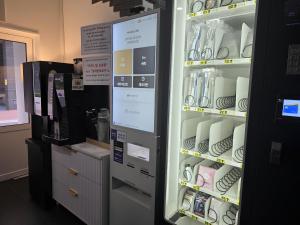 a refrigerator full of cups and plates in a store at Bucheon The Seollelm Hotel Stay in Bucheon