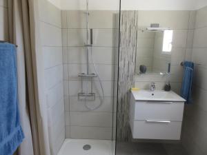 a bathroom with a shower and a sink at les terrasses d'arutoli in Porto-Vecchio
