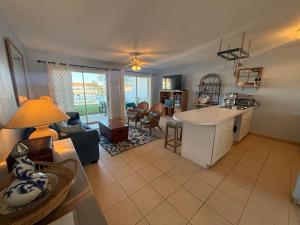 a kitchen and living room with a couch and a table at Bimini Paradies South Bimini North Bimini Bahamas Bimini 10B Alice Town in South Bimini