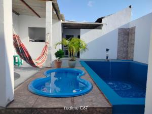 a swimming pool in the middle of a house at Casa por temporada - Espaço Oxente - Lazer e eventos in Paulo Afonso