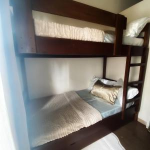 two sets of bunk beds in a room at MGs Dwell - Baguio Transient at Moldex Residences in Baguio