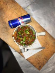a bowl of food on a table with a drink at Kasba Homes in Kalgha