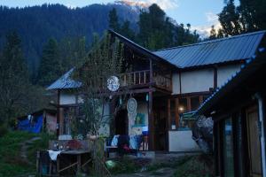 a house with a table in front of it at Kasba Homes in Kalgha +70 photos