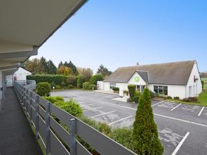a view from the balcony of a parking lot at Campanile Lens in Lens