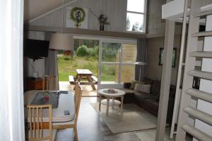 a living room with a couch and a table at 16 - Fulufjellets national parks - This is the place where Norway and Sweden meet in a large protected area in Ljørdal