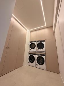 a laundry room with two washer and dryer at Da Nella 1 in Ancona