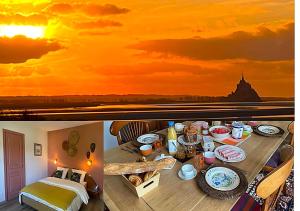 a table with food on it with a sunset at Parenthèse à la Maison de l'Ecrivain entre nature et petit déjeuner festin in Servon