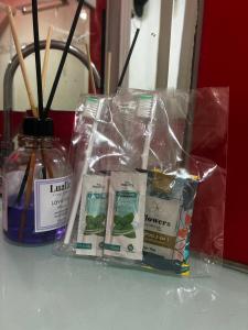 a package of herbs and a bottle of honey at Casa 100mtrs do mar com piscina aquecida in Solemar