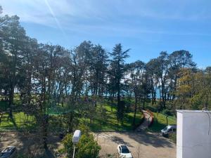 a view of a park with trees and a playground at Kobuleti hotel 656 in Kobuleti
