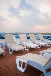 a row of lounge chairs on the deck of a boat at Blue Sea Explorer in Male City