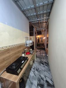 a kitchen with a stove top on a counter at d'Alvin Homestay 2 in Labuan Bajo