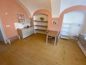 a living room with a table and a kitchen at Klášter Nová Říše in Nová Říše +29 photos