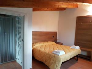 Postel nebo postele na pokoji v ubytování Agriturismo L'Ulivo