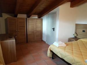 Postel nebo postele na pokoji v ubytování Agriturismo L'Ulivo