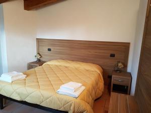 Postel nebo postele na pokoji v ubytování Agriturismo L'Ulivo