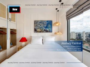 a bedroom with a white bed and a large window at Journey Central - Ho Chi Minh City - SOHO RESIDENCE in Ho Chi Minh City +71 photos