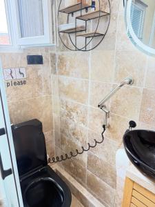a bathroom with a toilet and a sink at The13th in Rueil-Malmaison +177 photos