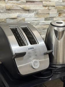 a toaster sitting on top of a stove at The13th in Rueil-Malmaison