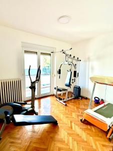 a room with a gym with exercise equipment in it at Blue View Apartment in Opatija