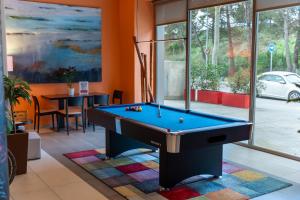 a billiard room with a pool table in it at Ibis Barcelona Mollet in Mollet del Vallès