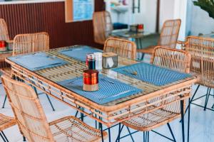 a table in a restaurant with chairs around it at New Modern Summer House in Moalboal