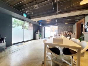 a dining room with a table and chairs at Orago Stay Hotel in Suwon
