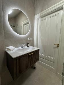 a bathroom with a sink and a mirror at Residentie Eys Anno 1929 in Eys +27 photos