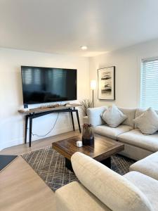 a living room with a large flat screen tv at LVC0615 - Lake Therapy in Zephyr Cove