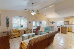 a living room with a couch and a table at Take Me To The Beach in Rockport