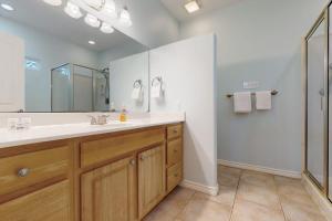 a bathroom with a large sink and a shower at Take Me To The Beach in Rockport +18 photos