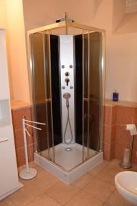 a shower in a bathroom with a glass enclosure at Casa del Drago in Sulzano +43 photos