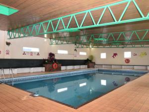 a large swimming pool in a building at 2 Bed in Brixham oc-57244 in Brixham