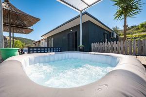 a hot tub in the backyard of a house at Lago Calmo Villa in Ksamil