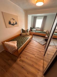 a room with a bed and a couch in it at Ferienwohnungen Rauch in Regen