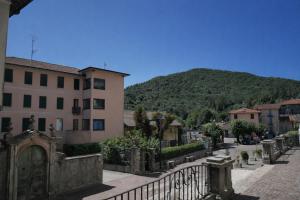 a view of a town with a mountain in the background at vitalArmonie Retreat in Marzio