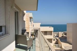 a balcony with a view of the ocean at Levante Sea View Apartment - Housea in Polignano a Mare